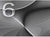 Motif d'horloge aspect aluminium avec grand chiffre 6 et lignes ondulées