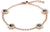 Rosenfarbenes Gliederarmband mit ovalen Elementen, schwarzem Einsatz und funkelnden Steinen