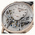 Herrenuhr: silbernes Zifferblatt mit römischen Indexen und sichtbarem Automatikwerk