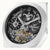 Herrenuhr: schwarzes Skelett-Zifferblatt mit sichtbarem Automatikwerk und Dual Time