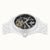 Herrenuhr im Detail von oben: schwarzes Zifferblatt mit sichtbarem Automatikwerk
