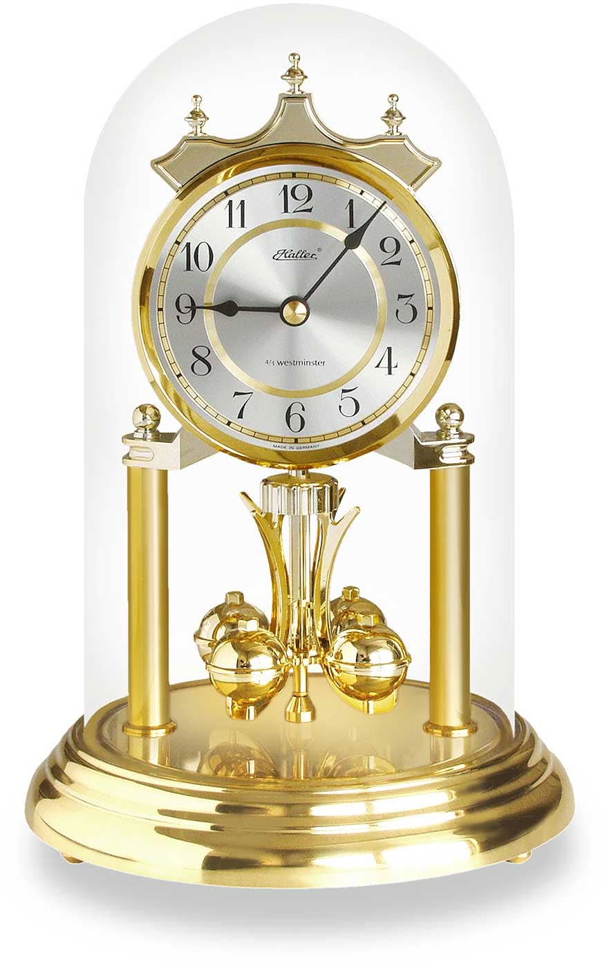 Horloge de table en laiton avec cadran rond, aiguilles dorées et pendule visible