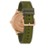 Montre pour homme vue de profil avec lunette en or rose et bracelet textile vert avec boucle ardillon