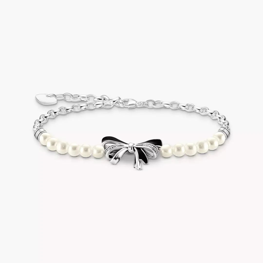 Bracelet en perles avec nœud, maillons argentés et nœud noir