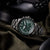 Herrenarmbanduhr mit grünem Zifferblatt und schwarzem Metallarmband, drei Chrono-Subdials