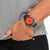 Eco-Drive Solar-Quarzuhr am Handgelenk, orange Zifferblatt und schwarzes Armband