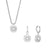 Ensemble de bijoux argentés : pendentif rond scintillant avec créoles et clous d'oreilles assortis.