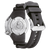 Vue arrière d'une montre pour homme avec bracelet en caoutchouc noir et insert de boîtier argenté.