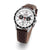 Montre chronographe avec cadran blanc et bracelet en cuir marron perforé.