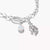 Bracelet chaîne argenté avec plusieurs breloques, dont une petite pierre bleu clair