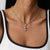Collier en argent avec petit breloque Snoopy et pierre colorée