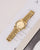 Mockberg Royal Damenarmbanduhr mit goldfarbenem Metallarmband, rundem Gehäuse und champagnerfarbenem Ziffernblatt