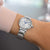 Citizen Damenuhr EM1070-83A mit silbernem Metallarmband und rundem Zifferblatt, blaue Zeiger.
