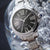 Citizen Armbanduhr mit schwarzem Zifferblatt, römischen Ziffern und Eco-Drive im Detail