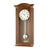 Pendule en noyer avec cadran rond et balancier