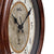 Cadran de montre murale AMS avec fond beige, aiguilles noires et cercle d'index