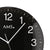 Horloge murale radio-pilotée AMS avec cadran noir, grands chiffres blancs et logo AMS