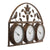 Ancienne horloge murale avec trois cadrans dans un cadre en métal et ornements d'oiseaux