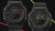 Zwei Ansichten der G-Shock-Armbanduhr: schwarz, Zifferblatt mit neonfarbenen Anzeigen und Schutzstruktur