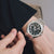 Casio G-SHOCK Herrenuhr am Handgelenk: silbernes Vollmetallarmband, schwarzes Zifferblatt
