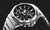Casio G-Shock Herrenuhr Nahansicht: schwarzes Ziffernblatt, Metallkrone und Gehäuseknöpfe