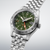 Seiko 5 Sports Uhr: grünes Zifferblatt, GMT-Orangezeiger, Datumsfenster, Stahl