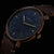 Herrenuhr mit blauem Zifferblatt, roségoldenen Zeigern und braunem Lederarmband