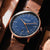 Montre homme avec cadran bleu, boîtier couleur or rose et bracelet en cuir marron
