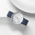 Mondaine Herrenuhr, blaues Armband, silbernes Zifferblatt mit roten Sekundenzeiger