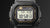 Casio G-Shock Herrenuhr Close-up: schwarzes Gehäuse mit Digitaldisplay und Akzenten.