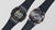 Casio G-Shock Uhrenpaar mit dunklen Gehäusen und schwarzem Textilband, von oben.