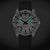 Montre Mondaine pour homme avec cadran blanc et bracelet en silicone noir, avec effet lumineux vert