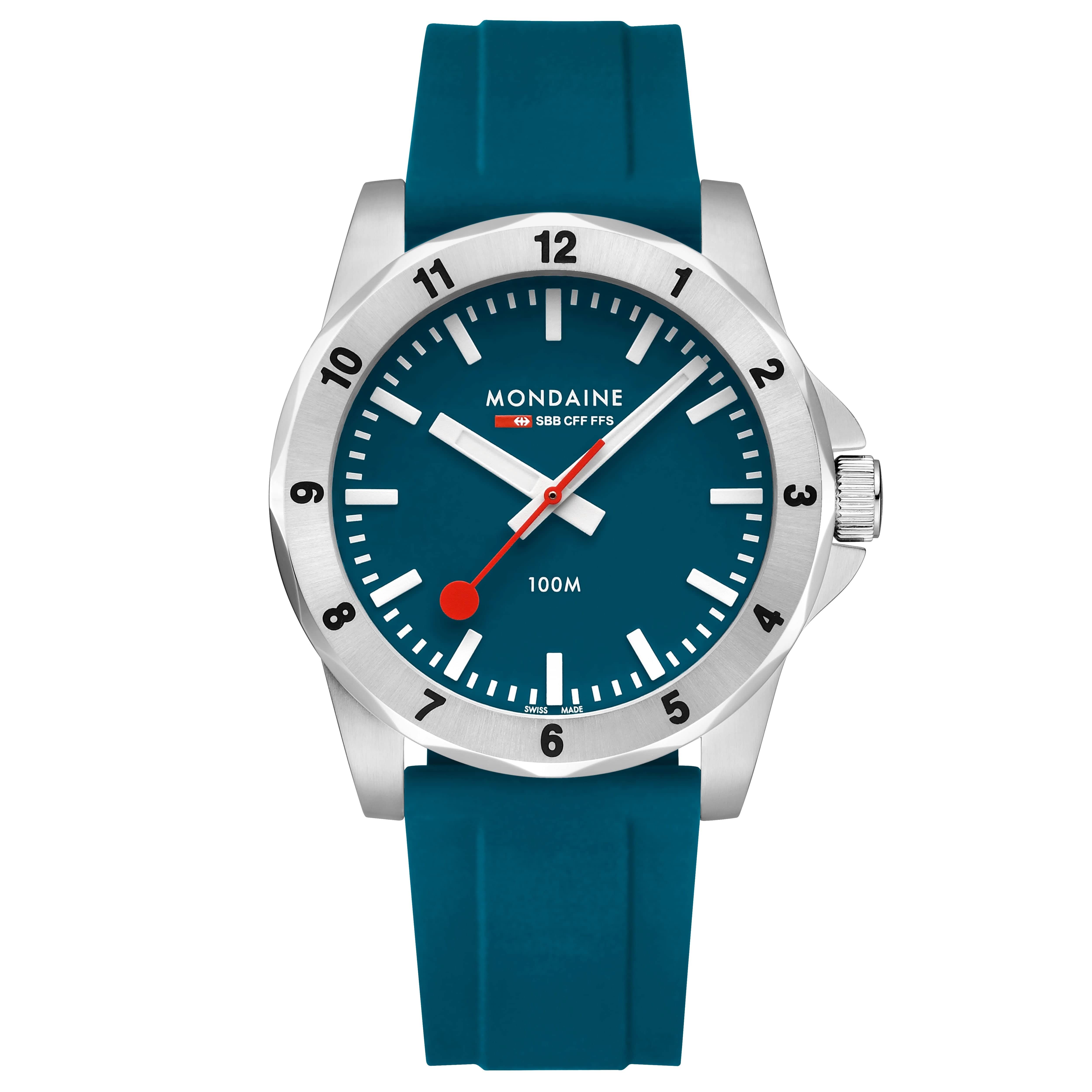 Montre homme avec bracelet en silicone bleu, cadran bleu foncé et boîtier argenté.