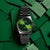 Montre Casio avec cadran vert et bracelet en métal, ronde, affichage de la date