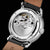Montre automatique unisexe avec fond transparent : mouvement dans un boîtier en acier inoxydable, bracelet en cuir noir