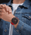 Police Herrenuhr am Handgelenk mit rotem Silikonband und schwarzem Chronograph-Display