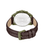 Uhrboden mit Relief in Grün, braunes Lederarmband mit Dornschließe