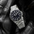 Lorus Sport Armbanduhr mit schwarzem Zifferblatt, silbernem Metallarmband und Datumsanzeige