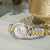 Lorus Damenarmbanduhr, Seitenansicht mit Metallband silber/gold und weißem Zifferblatt