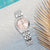 Lorus Damenuhr mit Edelstahlarmband, rosa Zifferblatt und Mineralglas