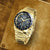 Herren-Armbanduhr Lorus Sport, goldfarbenes Edelstahlarmband, schwarzes Zifferblatt mit Chronograph
