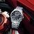 Sport-Armbanduhr mit Edelstahlband und schwarzem Chronograph-Zifferblatt, Solar-Anzeige