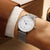 Montre pour femme au poignet, cadran blanc avec aiguille bleue, bracelet en maille