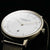 Montre pour femme avec cadran blanc, mouvement doré et bracelet milanais