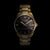 Herrenarmbanduhr goldfarben mit schwarzem Zifferblatt, Indexen und Datum 28