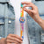 Transparente Swatch-Armbanduhr mit farbigem Kunstdruck-Zifferblatt und buntem Armband