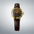 Montre pour femme avec bracelet en cuir marron, boîtier rond doré et cadran sombre