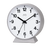 Réveil JVD avec cadran rond blanc et mouvement analogique à aiguilles noires