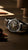 Seiko Presage Herrenuhr, rundes Gehäuse mit schwarzem Zifferblatt und silberner Lünette