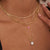 Collier multicolore doré avec pendentif perle et détail bijou rond